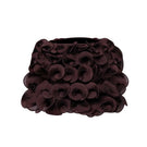 Brown Stolen Stores spiral mini skirt displayed on a model, showcasing its fitted design and stylish spiral pattern.