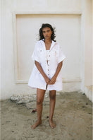 White Minita blouse by ANA + MARIA, featuring lightweight fabric and a relaxed fit, displayed on a neutral background.
