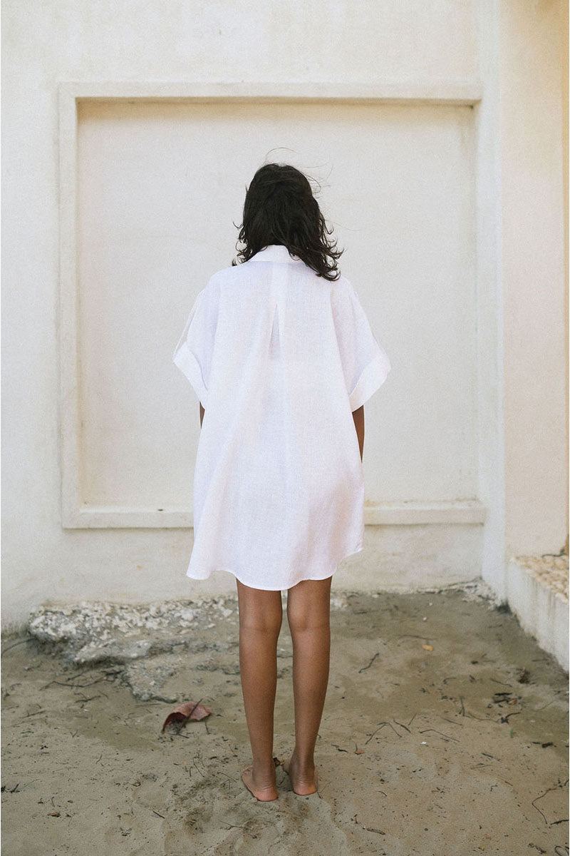 White MINITA blouse by ANA + MARIA in a loose, stylish tops design, shown on a neutral background.