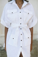 White Minita blouse by ANA + MARIA, featuring a stylish top with a relaxed fit and feminine design, displayed on a model.