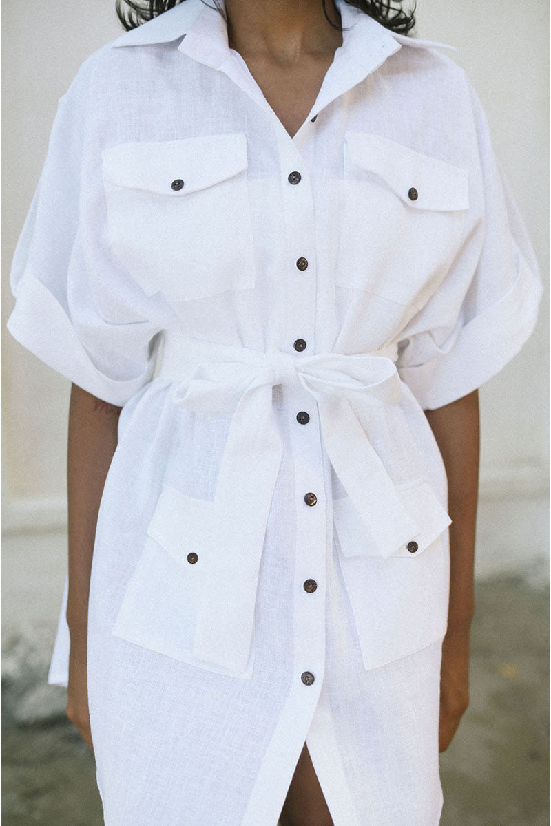 White Minita blouse by ANA + MARIA, featuring a stylish top with a relaxed fit and feminine design, displayed on a model.