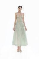 Mint V-neck draped midi dress by Montsand, showcasing a flowing silhouette and elegant design on a model.