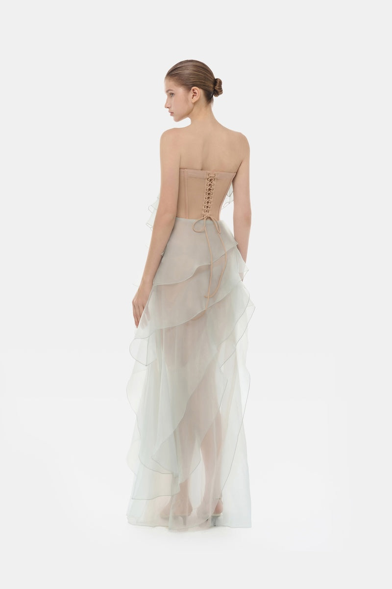 Mint green tiered strapless maxi dress by Montsand, flowing fabric with layered design, perfect for summer or special occasions.