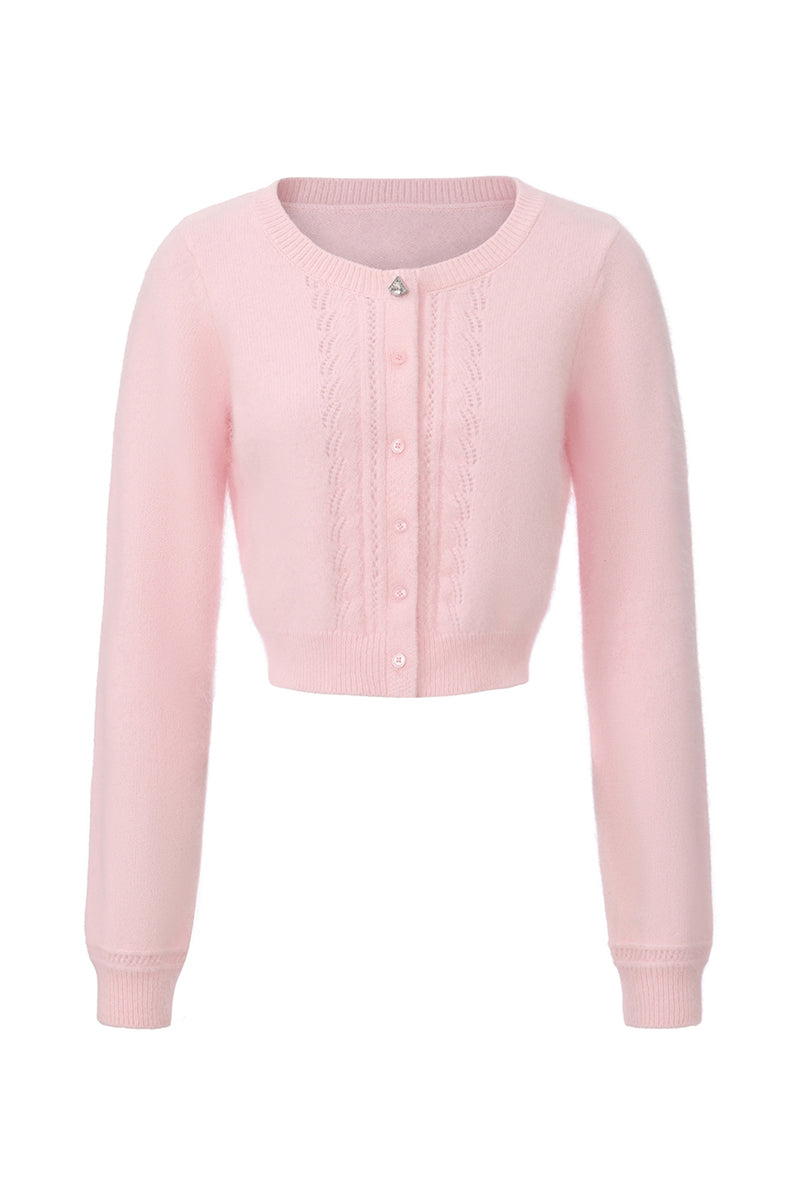 Pink knitted Mirabelle cardigan by Nana Jacqueline, featuring a cozy, stylish design with button details and ribbed cuffs.