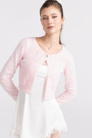 Pink knitted Mirabelle cardigan by Nana Jacqueline, featuring a cozy, stylish design perfect for layered fall outfits.