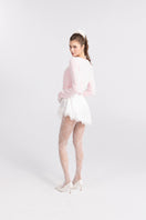 Pink knitted Mirabelle cardigan by Nana Jacqueline featuring a cozy, textured design and button-up front.