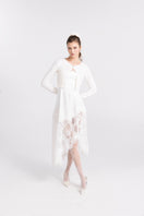 White knitted Mirabelle cardigan by Nana Jacqueline with long sleeves and a cozy, textured knit design.