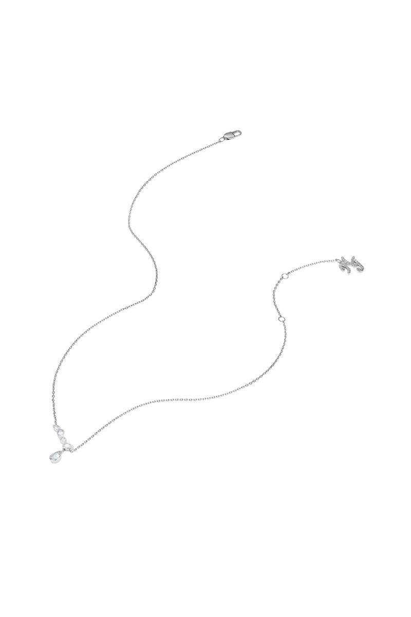 Silver Mirabelle necklace with teardrop pendant by Nana Jacqueline, displayed from the side on a clean background.