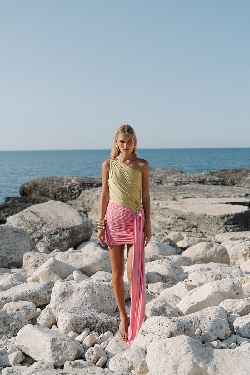 Gigii's Mirage Mini Dress shown on a model, featuring a stylish, fitted design with vibrant patterns perfect for casual or evening wear.