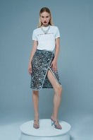 Silver embroidered midi skirt by Mirel Prentice, featuring intricate embroidery and a flowing midi length design.