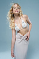 Mirel Prentice crochet flower bra top with detailed knit flower design, paired with a matching knot skirt.