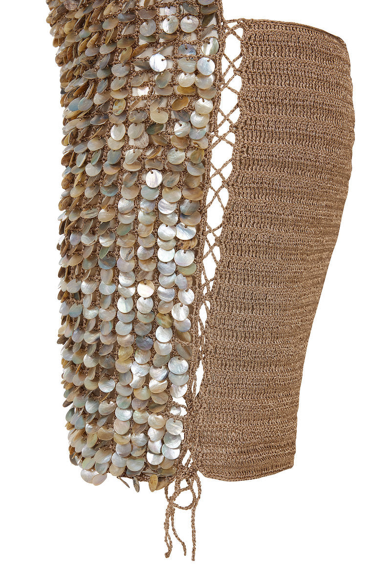 Side view of Mirel Prentice hand-crochet mother of pearl mini dress, showcasing intricate pearl details and elegant fit.