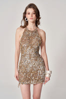 Hand-crochet Mother of Pearl mini dress by Mirel Prentice, showcasing intricate pearl details and a stylish, fitted silhouette.