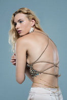 Crochet mother of pearl top by Mirel Prentice featuring intricate crochet design and shimmering pearl accents.