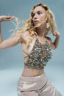 Crochet mother of pearl top by Mirel Prentice, showcasing intricate crochet detailing and lustrous pearl accents.
