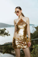 Hand-crocheted mini skirt by Mirel Prentice with gold matte sequins, detailed texture, and a stylish fit.