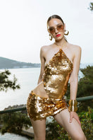 Hand-crochet sequined open-back top in matte gold by Mirel Prentice, featuring intricate detailing and a stylish design.