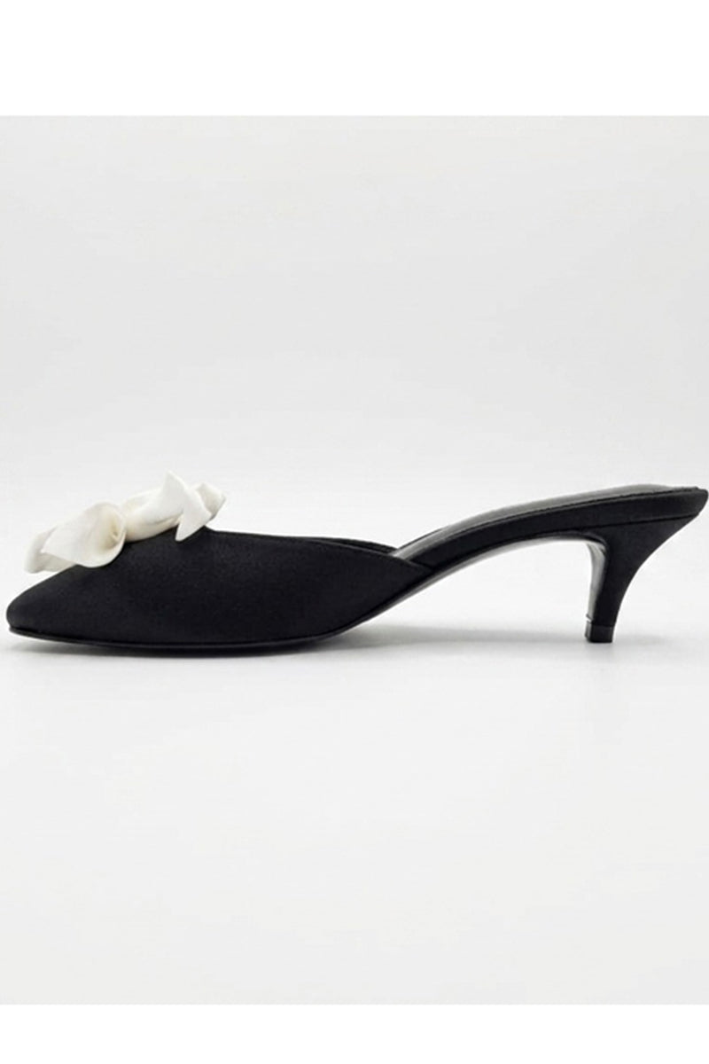 Black MIST HEELS by YASSMIN SALEH, stylish heels with a sleek design, shown outside with natural lighting and ghostly background.