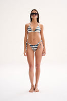 Nelblu SOL top bikini in blue print, model wearing stylish swimwear with colorful pattern, front view.