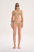 Nelblu LILI print orange bikini top on a model, featuring vibrant swimwear design perfect for beach or pool days.