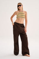 Model wearing Nelblu Cyndi Pant in marrón, a stylish cover-up with a relaxed fit and comfortable fabric.