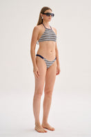 Nelblu Ginni top bikini in blue print, featuring a stylish swimwear design with adjustable straps on a model.