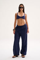 Nelblu Chloe blue cover-up pants worn by a model, stylish and lightweight, perfect for beach or poolside cover-up fashion.