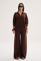 Nelblu Aurora brown pants worn by a model, stylish and comfortable women's fashion with a relaxed fit.