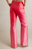 Model wearing SemSem DÉGRADÉ Duchesse-Satin wide-leg pink pants, back view showing the flowy, high-waisted design.