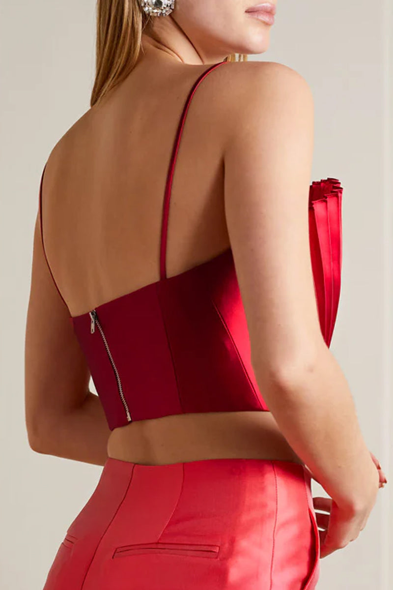 Model wearing a red SemSem cropped plissé-satin bustier top, showing the back detail and fitted style.