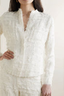White silk chiffon blouse with embellishments by SemSem, shown on model front view, featuring elegant fabric and decorative details.