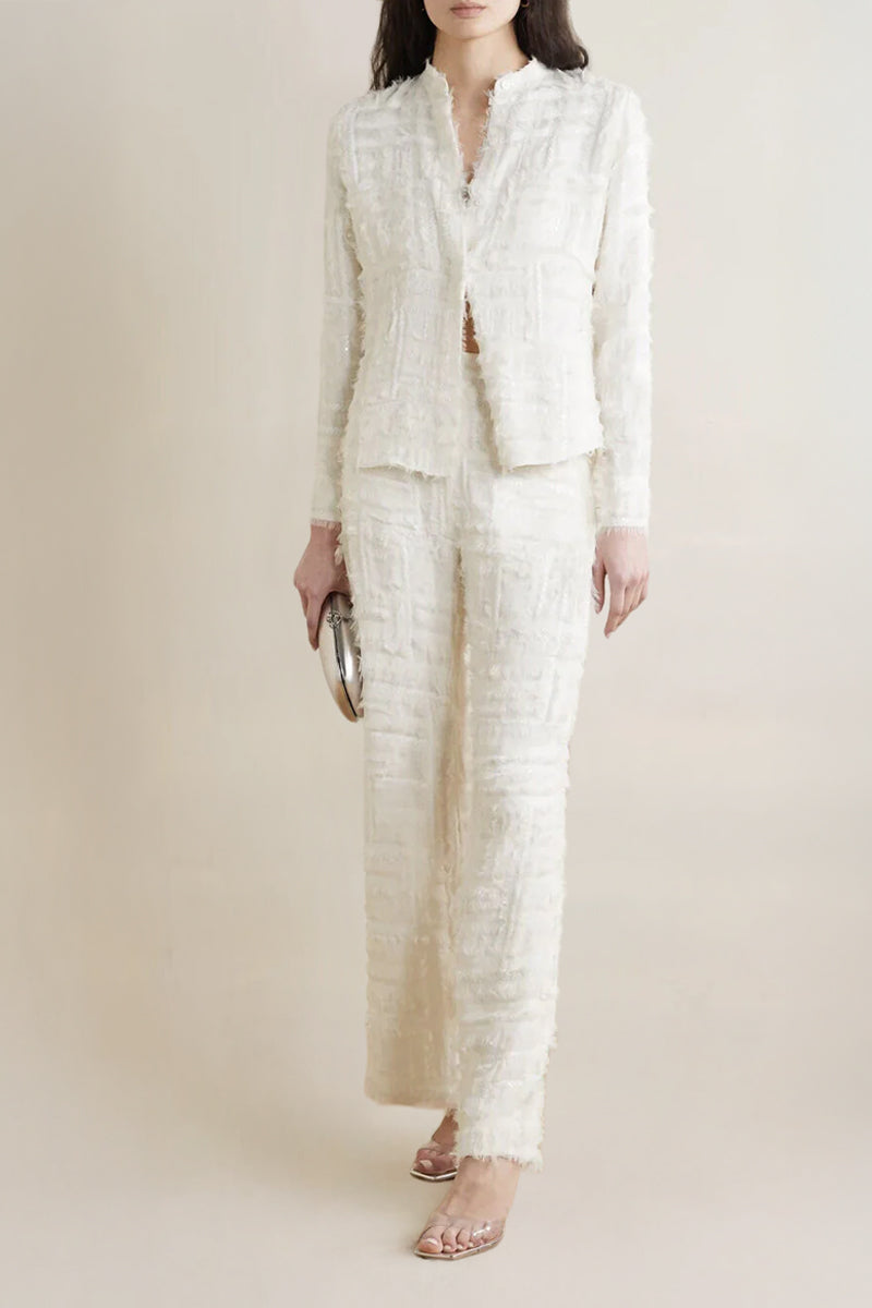 Model wearing a white silk chiffon embellished blouse from SemSem, front view showing delicate detailing and elegant fit.