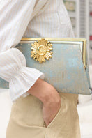 Multicolor Moon Rays on Lagoon Grace clutch bag by Sarah's Bag featuring vibrant, artistic design with a sleek shape.