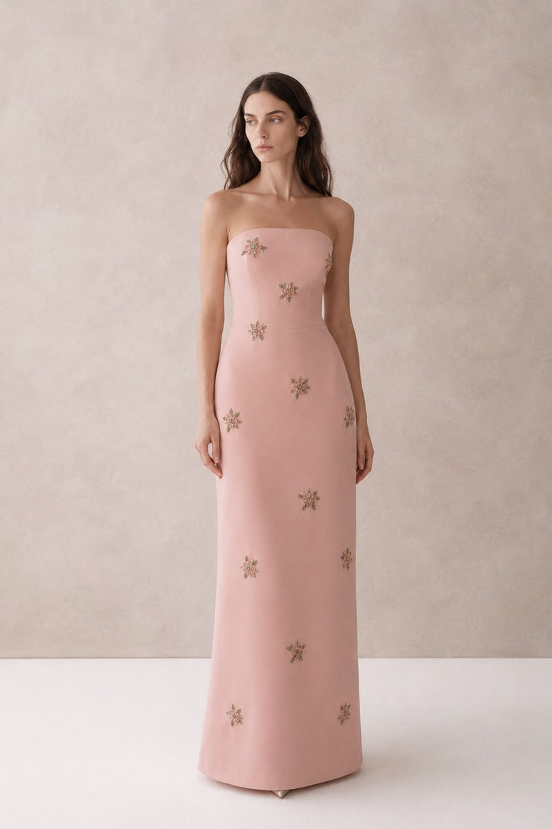 Light pink Moona Dress gown by Nihan Peker with flowing fabric and elegant design, perfect for formal occasions.