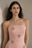 Light pink Moona dress gown by Nihan Peker, featuring flowing fabric and elegant design, displayed on a mannequin.
