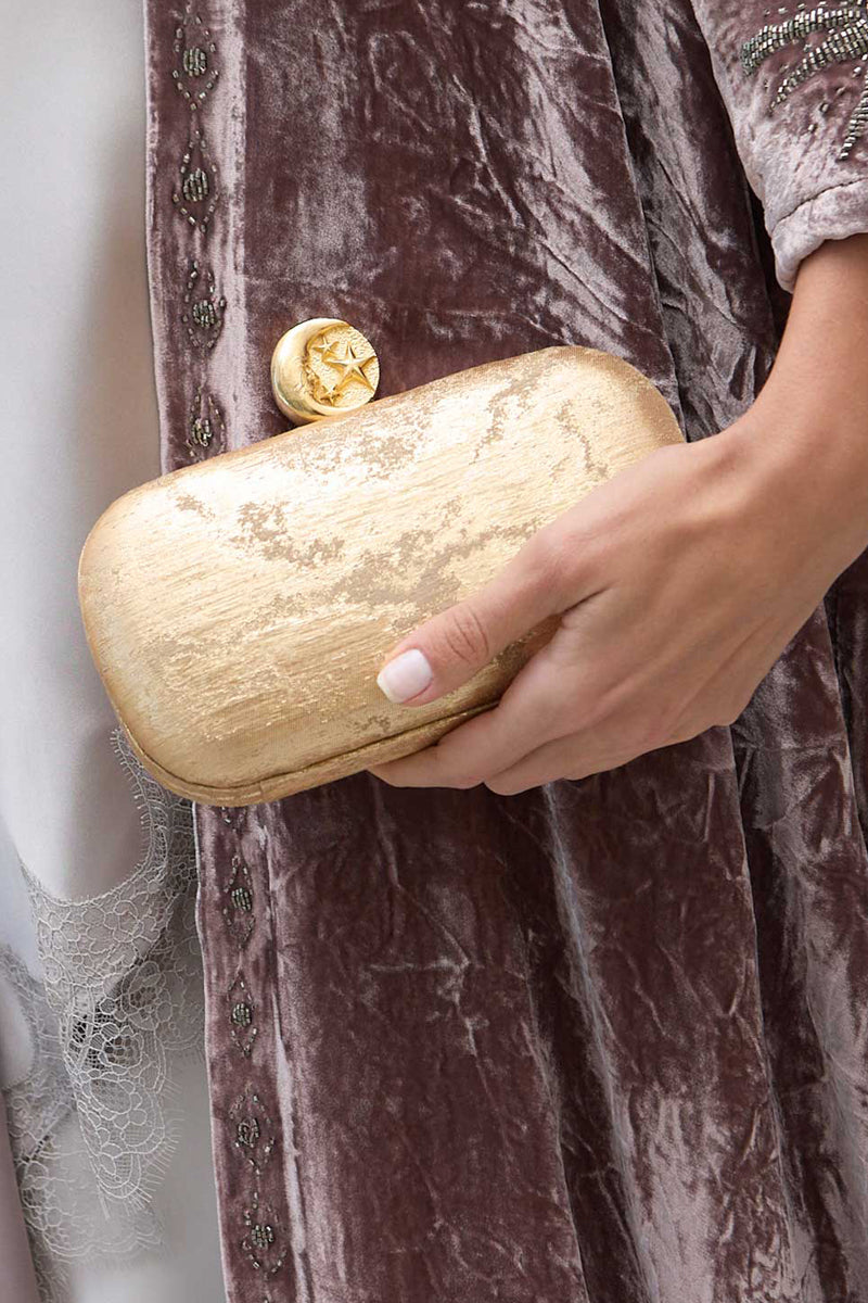 Gold clutch bag with moon design from Sarah's Bag, featuring a sleek, compact style perfect for evening occasions.