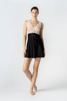 Black NK IMODE Morgan bust support chemise nightgown with front profile view, featuring a sleek, fitted design and comfortable fabric.