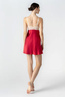 NK IMODE Morgan bust support chemise nightgown in scarlet with champagne accents, shown from the back.