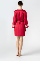 NK IMODE CULT MIA X NK IMODE MORGAN short robe in scarlet with champagne accents, shown from the back profile.