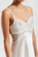 Ivory silk chemise nightgown with bust cradle design by NK IMODE, featuring delicate lace details and smooth, flowing fabric.
