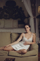Ivory silk chemise nightgown with a bust cradle design by NK IMODE, featuring smooth fabric and delicate detailing.
