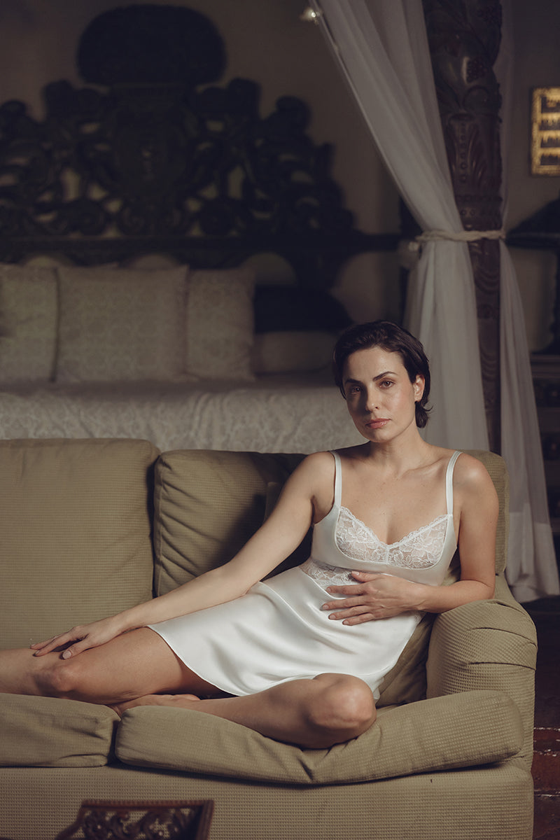 Ivory silk chemise nightgown with a bust cradle design by NK IMODE, featuring smooth fabric and delicate detailing.