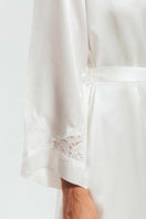 Ivory silk robe from NK IMODE's Morgan Long Silk Robe collection, featuring elegant fabric and detailed design.