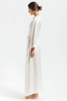 Ivory silk robe from NK IMODE's Morgan Long Silk Robe collection, shown hanging open with elegant drape and smooth fabric.