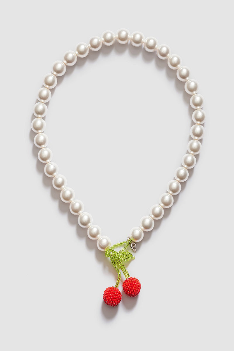 Pura Utz Mother of Cherry Necklace featuring a delicate cherry pendant on a fine chain, stylish and elegant jewelry accessory.