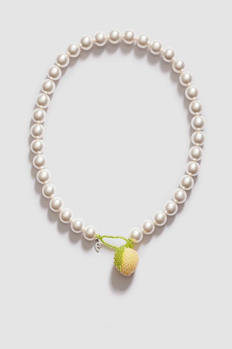 Pura Utz Mother of Lemon Necklace featuring a delicate pendant with lemon motif on a silver chain.