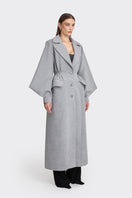 Gray coat from Stolen Stores' Ms. Doll collection, stylish and cozy with a tailored fit, shown on a mannequin.