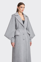 Gray coat from Stolen Stores MS. DOLL collection, featuring a stylish, tailored design with a collar and button details.