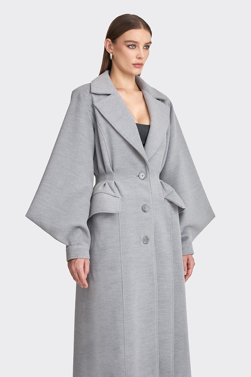 Gray coat from Stolen Stores MS. DOLL collection, featuring a stylish, tailored design with a collar and button details.