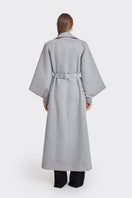 Gray coat from the MS. DOLL collection by Stolen Stores, displayed on a model with stylish details and a modern fit.